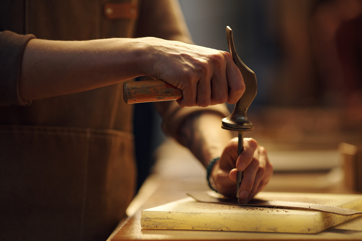 crafting wooden furniture with hand tools in workshop